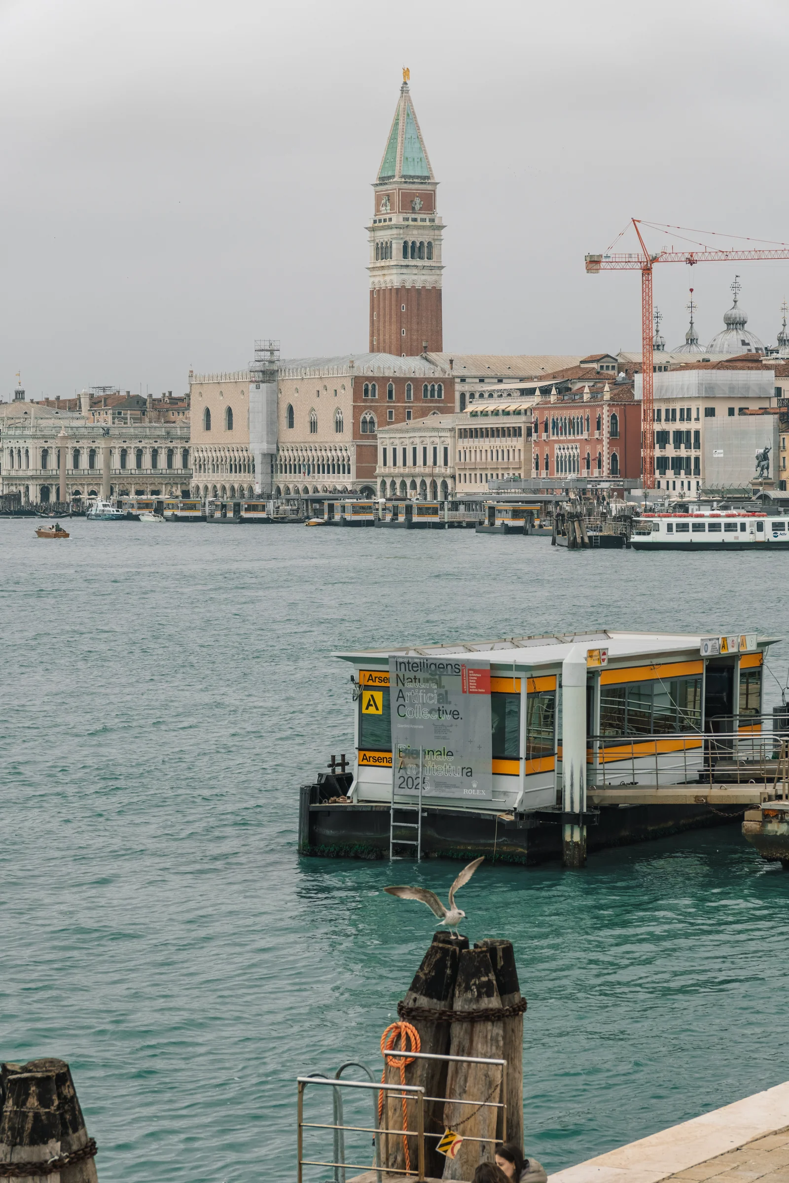 The Campanile and Doge's Palace across the basin, an Arsenale vaporetto stop in the foreground